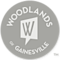 The Woodlands of Gainesville logo